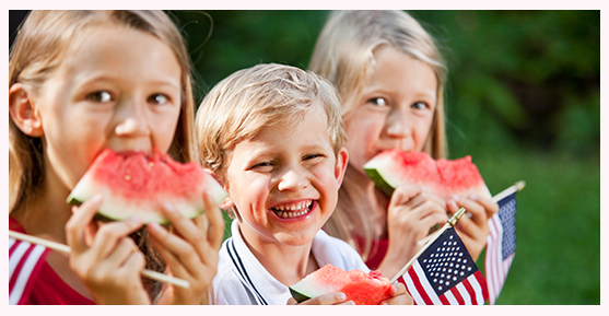 Kids enjoying watermelon